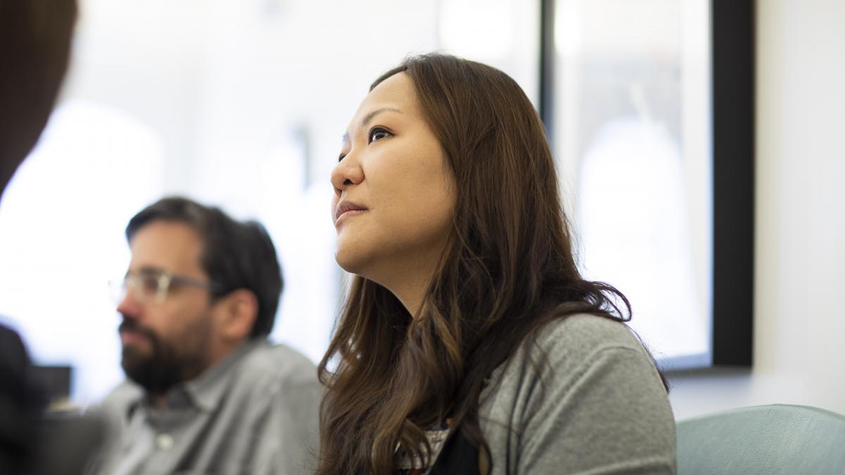Photo of a man and woman looking attentively