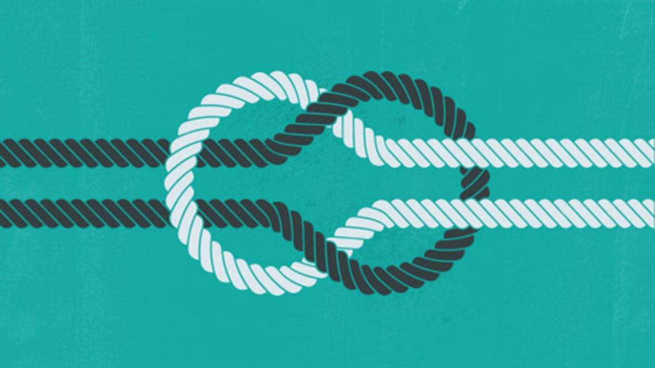 Black and white ropes forming a loose knot