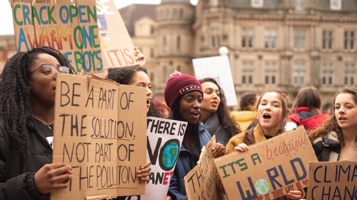 Holding up signs in protest of climate change