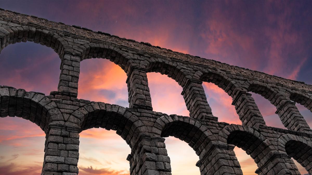Photo of a Roman Aqueduct at sunrise
