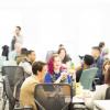 Palantir team sitting at tables together