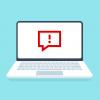 Illustration of a laptop with a dialog box with an exclamation point on the screen