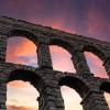 Photo of a Roman Aqueduct at sunrise